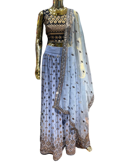 Blue Iris Lehenga - A stunning ensemble with blue embroidery and sequins work all over crafted on georgette fabric. You will be sure to turn heads when you walk into the room for that special occasion.
Current blouse size 38

 
